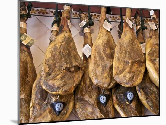 Spanish Hams Hanging in a Restaurant Bodega, Seville, Andalusia, Spain, Europe-Guy Thouvenin-Mounted Photographic Print