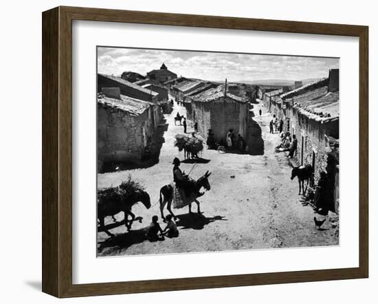 Spanish Village Showing Rows of Crude Stone and Adobe Houses-W^ Eugene Smith-Framed Photographic Print