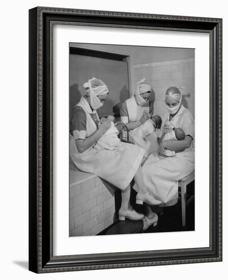 Special Nursery Nurses Wearing Masks as They Bottle-Feed Fully Developed Premature Babies-Hansel Mieth-Framed Photographic Print