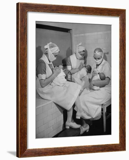 Special Nursery Nurses Wearing Masks as They Bottle-Feed Fully Developed Premature Babies-Hansel Mieth-Framed Photographic Print