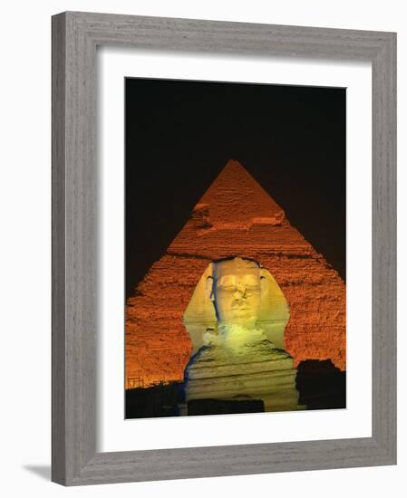 Sphinx and One of the Pyramids Illuminated at Night, Giza, Cairo, Egypt-Nigel Francis-Framed Photographic Print