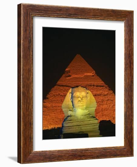 Sphinx and One of the Pyramids Illuminated at Night, Giza, Cairo, Egypt-Nigel Francis-Framed Photographic Print