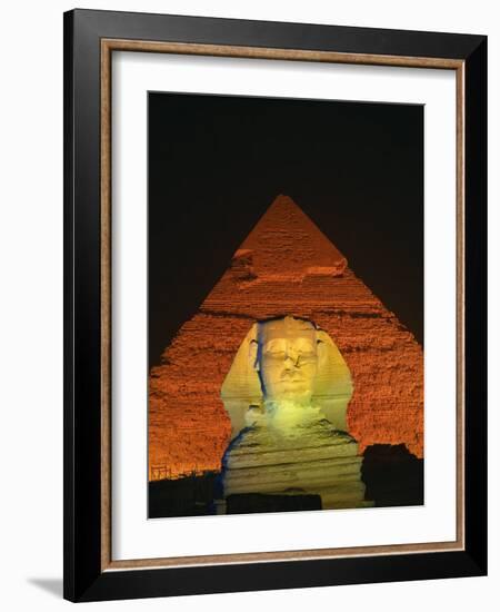 Sphinx and One of the Pyramids Illuminated at Night, Giza, Cairo, Egypt-Nigel Francis-Framed Photographic Print