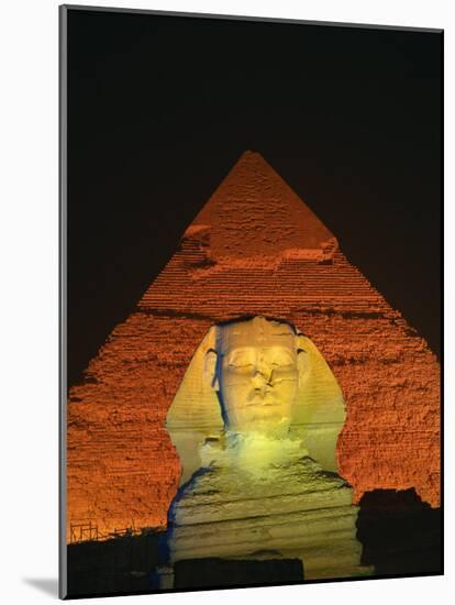 Sphinx and One of the Pyramids Illuminated at Night, Giza, Cairo, Egypt-Nigel Francis-Mounted Photographic Print