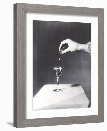 Spiking a Drink-null-Framed Photo