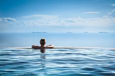 Woman Relaxing in Infinity Swimming Pool on Vacation-Splendens-Premier Image Canvas