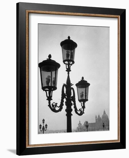 Splendor of a Street Light in the Piazza San Marco with the Santa Maria Della Salute Church-Dmitri Kessel-Framed Photographic Print