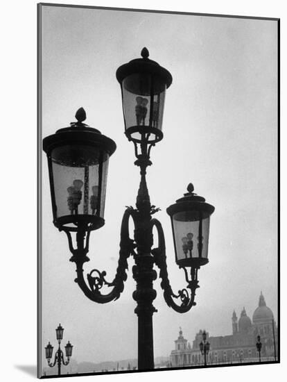 Splendor of a Street Light in the Piazza San Marco with the Santa Maria Della Salute Church-Dmitri Kessel-Mounted Photographic Print