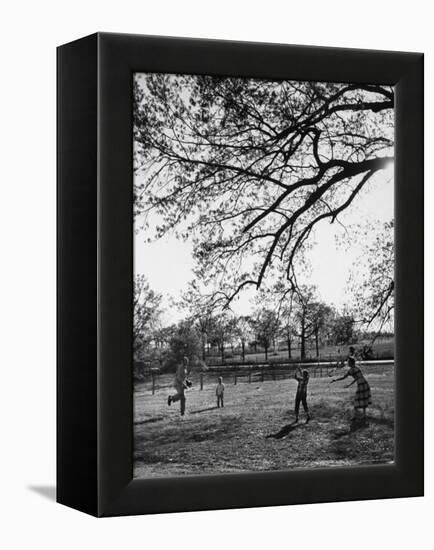 Springtime in Clarksville on a Farm with a Family Playing Baseball in the Yard-Yale Joel-Framed Premier Image Canvas