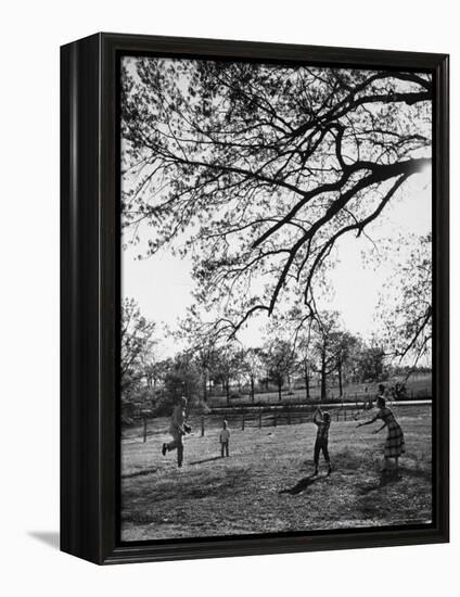 Springtime in Clarksville on a Farm with a Family Playing Baseball in the Yard-Yale Joel-Framed Premier Image Canvas