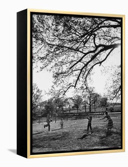 Springtime in Clarksville on a Farm with a Family Playing Baseball in the Yard-Yale Joel-Framed Premier Image Canvas