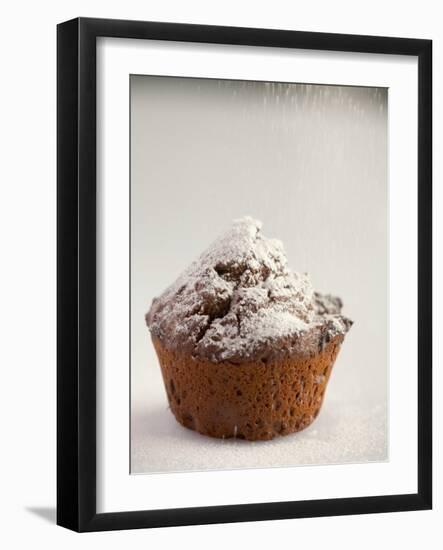 Sprinkling a Chocolate Muffin with Icing Sugar-null-Framed Photographic Print