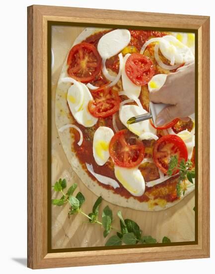 Sprinkling Pizza with Olive Oil-null-Framed Premier Image Canvas