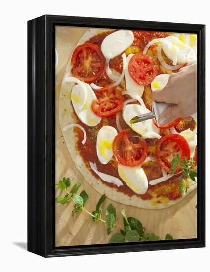 Sprinkling Pizza with Olive Oil-null-Framed Premier Image Canvas