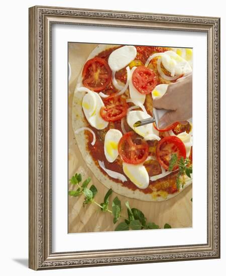 Sprinkling Pizza with Olive Oil-null-Framed Photographic Print