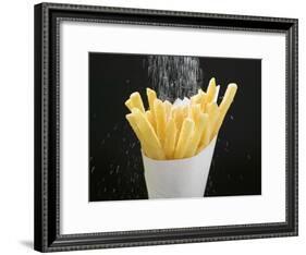 Sprinkling Salt over Chips-null-Framed Photographic Print