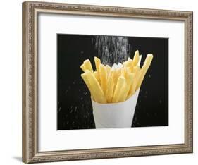 Sprinkling Salt over Chips-null-Framed Photographic Print