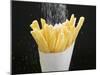 Sprinkling Salt over Chips-null-Mounted Photographic Print