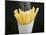 Sprinkling Salt over Chips-null-Mounted Photographic Print