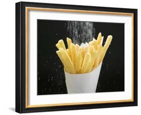 Sprinkling Salt over Chips-null-Framed Photographic Print