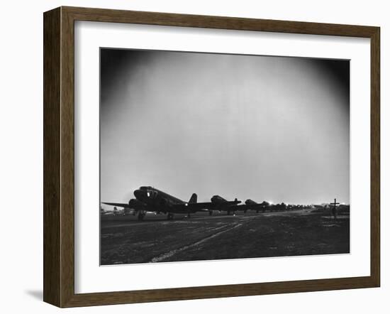 Squadron of C-47 Cargo Transports Preparing for an Evening Take Off During WWII-null-Framed Photographic Print