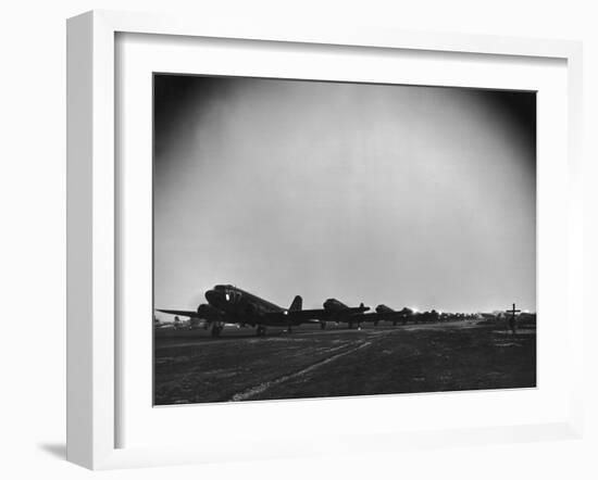 Squadron of C-47 Cargo Transports Preparing for an Evening Take Off During WWII-null-Framed Photographic Print