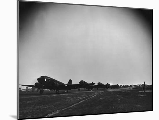 Squadron of C-47 Cargo Transports Preparing for an Evening Take Off During WWII-null-Mounted Photographic Print