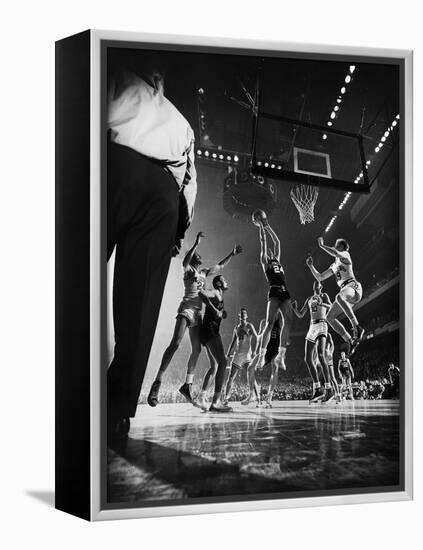 St. John's Defeating Bradley in a Basketball Game at Madison Square Garden-Gjon Mili-Framed Premier Image Canvas