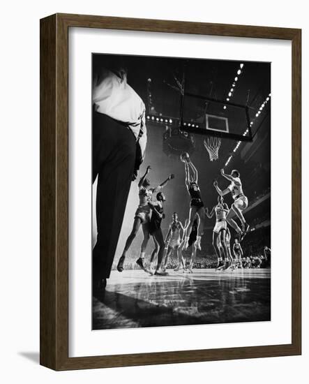 St. John's Defeating Bradley in a Basketball Game at Madison Square Garden-Gjon Mili-Framed Photographic Print