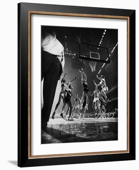 St. John's Defeating Bradley in a Basketball Game at Madison Square Garden-Gjon Mili-Framed Photographic Print