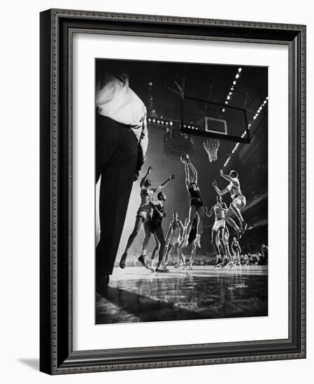 St. John's Defeating Bradley in a Basketball Game at Madison Square Garden-Gjon Mili-Framed Photographic Print