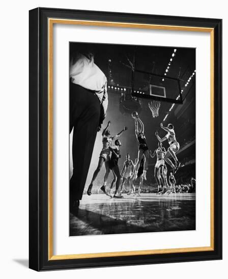 St. John's Defeating Bradley in a Basketball Game at Madison Square Garden-Gjon Mili-Framed Photographic Print