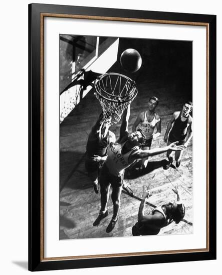 St. John's University Player Ivor Sumner Making a Lay-up Basket Through a "Keaney Ring"-Gjon Mili-Framed Photographic Print