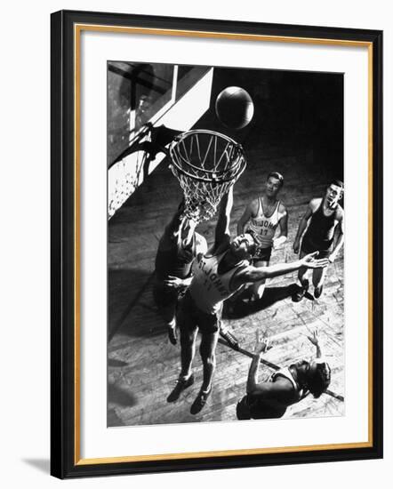 St. John's University Player Ivor Sumner Making a Lay-up Basket Through a "Keaney Ring"-Gjon Mili-Framed Photographic Print