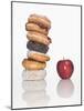 Stack of Donuts and One Apple-null-Mounted Photographic Print