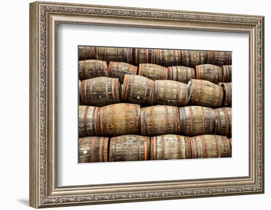 Stacked Pile of Old Whisky and Wine Wooden Barrels-MartinM303-Framed Photographic Print