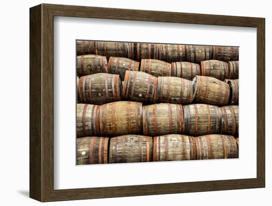 Stacked Pile of Old Whisky and Wine Wooden Barrels-MartinM303-Framed Photographic Print