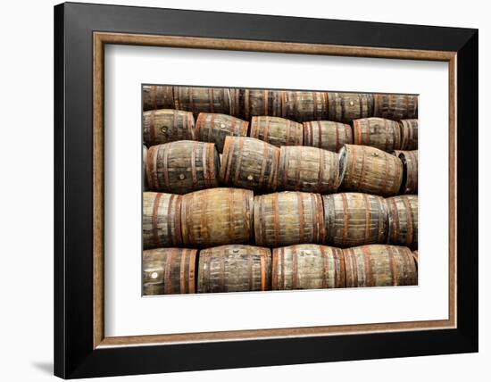 Stacked Pile of Old Whisky and Wine Wooden Barrels-MartinM303-Framed Photographic Print