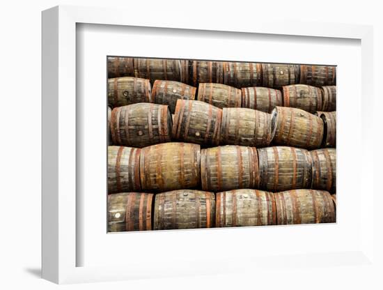 Stacked Pile of Old Whisky and Wine Wooden Barrels-MartinM303-Framed Photographic Print
