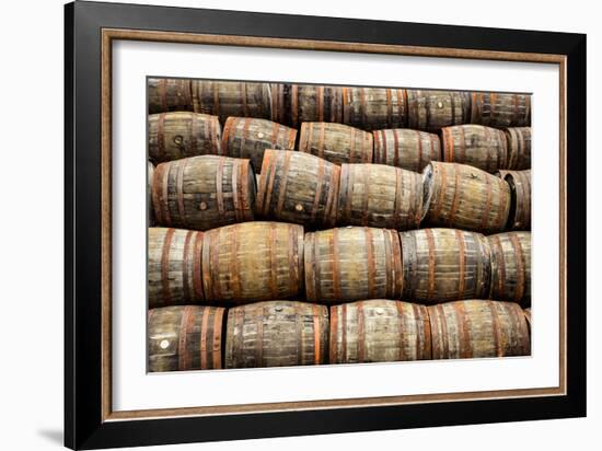 Stacked Pile of Old Whisky and Wine Wooden Barrels-MartinM303-Framed Photographic Print