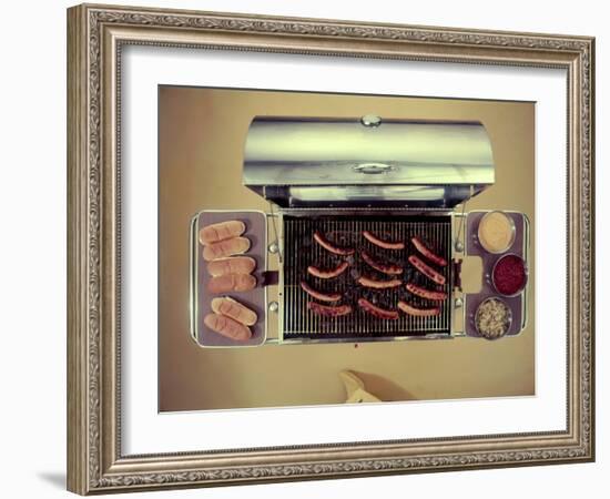 Stainless Steel Barbecue Grill, Upon Which are Buns, Hot Dogs, and Condiments, 1960-Eliot Elisofon-Framed Photographic Print