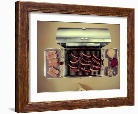 Stainless Steel Barbecue Grill, Upon Which are Buns, Hot Dogs, and Condiments, 1960-Eliot Elisofon-Framed Photographic Print