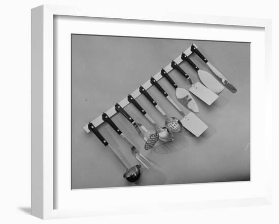 Stainless Steel Kitchen Utensils Hanging on a Rack-null-Framed Photographic Print