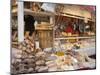 Stall Selling Cheese, Fruit Cake and Sausages at Christmas Market on Maxheinhardtplatz-Richard Nebesky-Mounted Photographic Print