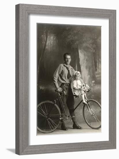 Standing Bicyclist with Little Girl on Handlebars-null-Framed Art Print