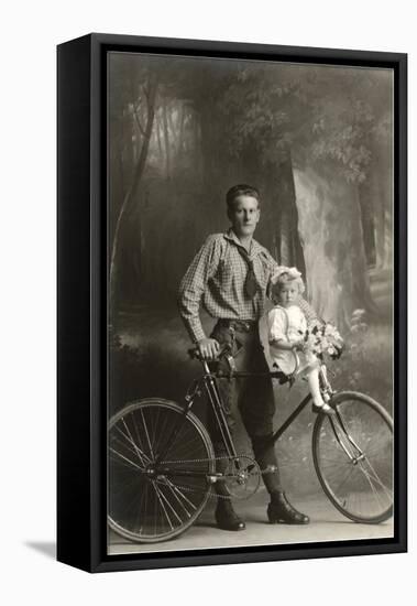 Standing Bicyclist with Little Girl on Handlebars-null-Framed Stretched Canvas