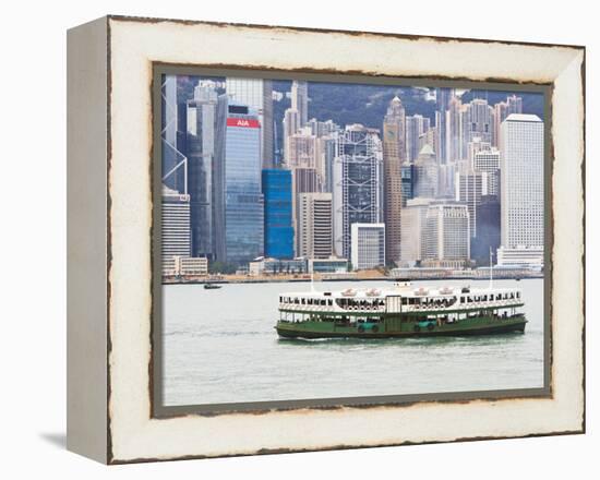 Star Ferry Crosses Victoria Harbour with Hong Kong Island Skyline Behind, Hong Kong, China, Asia-Amanda Hall-Framed Premier Image Canvas