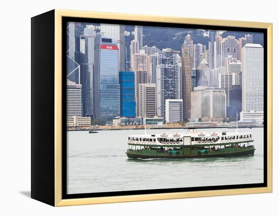 Star Ferry Crosses Victoria Harbour with Hong Kong Island Skyline Behind, Hong Kong, China, Asia-Amanda Hall-Framed Premier Image Canvas