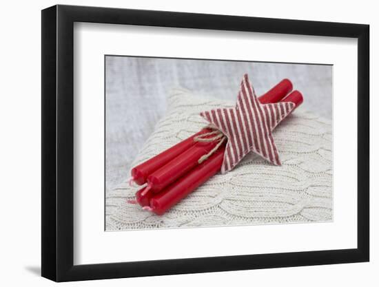 Star of Bethlehem and candles on cushion, still life-Andrea Haase-Framed Photographic Print