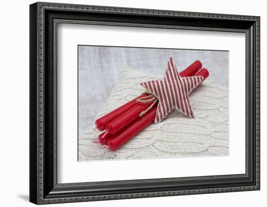 Star of Bethlehem and candles on cushion, still life-Andrea Haase-Framed Photographic Print